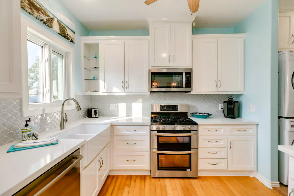 Bright white kitchen with gas range
